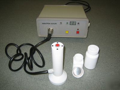 New induction sealer with 1 yr warr. $2300